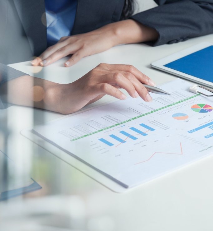 Businesswoman Looking Over Graphs